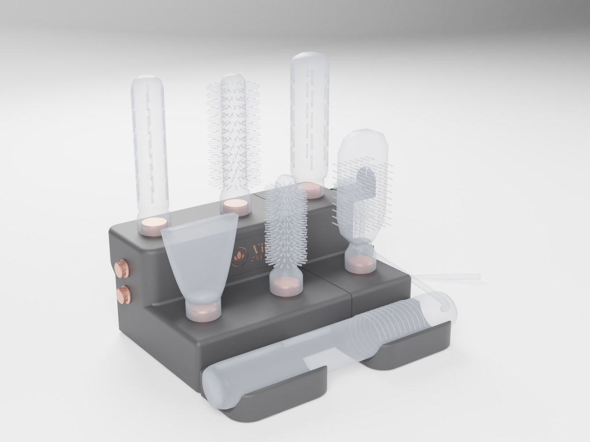 Black and rose gold stand with a styler in the cradle and six attachments on the pegs. Styler and attachments shown faded and not included (CAD render)