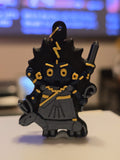 Kalaratri keychain: dark blue chibi devi with wild black hair, a gold lightning bolt, sword and iron hook, in a grey sari riding a donkey